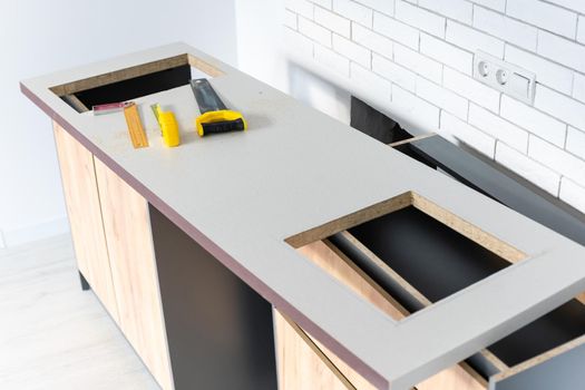 to cut holes in the kitchen countertop for equipment