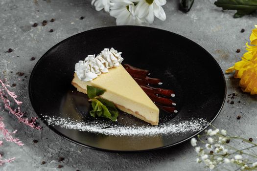 Dessert - Cheesecake with Berries Sauce and Green Mint.