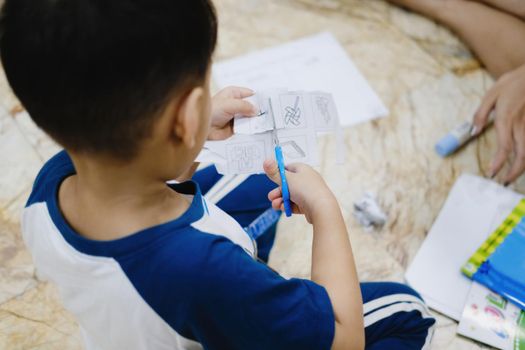 Childhood are learning to use scissors to cut paper