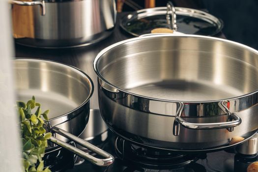 Frying pan on the gas stove in a kitchen. Close up.