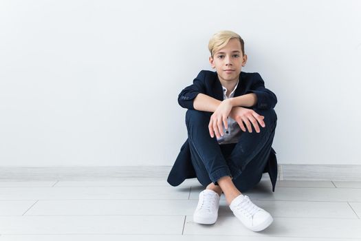 Teenage depression and puberty concept - Sad teenager portrait close up on white.