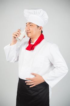 chef holding glass cup and drink yogurt or milk nice photo