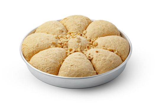 Turkish dessert halva in metal tray isolated on white background