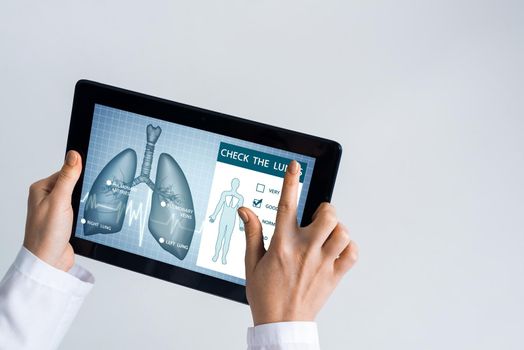 Tablet pc device with medicine interface screen in hands of doctor