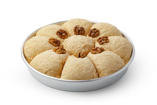 Turkish dessert halva in metal tray isolated on white background