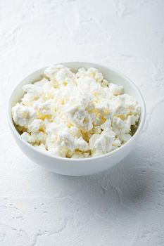 Cottage cheese, curd, on white textured background