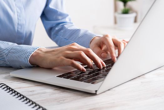 Office manager working with laptop. Corporate office workplace with computer. Business occupation concept with business woman at vintage wooden desk. Career development and success.