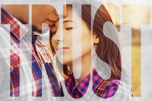 Double exposure word trust combined with image of couple in love outdoor