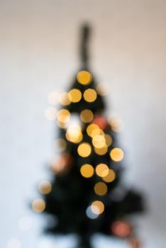 Merry Christmas background. blurred christmas tree with fairy lights