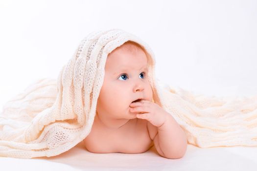 Cute baby girl on white background. Baby with a towel on his head