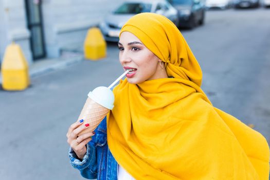 Arabian muslim woman enjoying cocktail outdoor