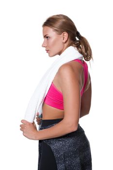 Portrait of sporty young woman tired after a gym workout. Woman with a white towel and a bottle of water isolated on white background