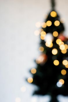 Merry Christmas background. blurred christmas tree with fairy lights