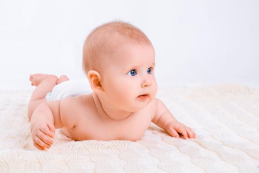 Cute baby girl on white background. Baby in diaper