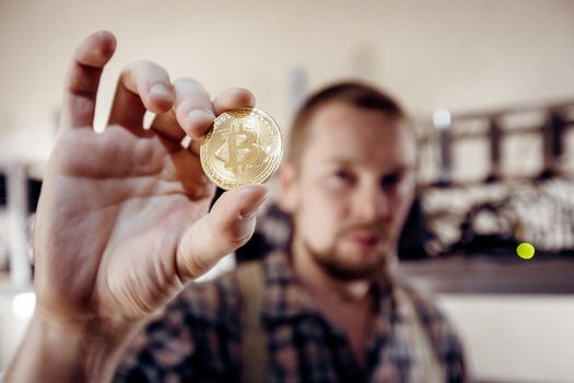 Coin sign close-up, which is held by a man