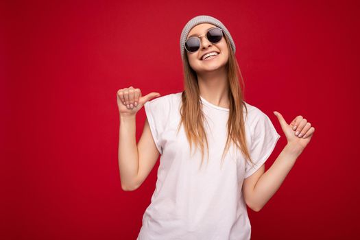 Photo of cute nice winsome positive adult woman wearing casual outfit isolated on background wall with copy space pointing at herself.