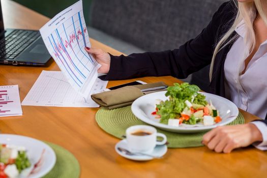 A woman and a man on a business lunch in a restaurant. meet the project and data