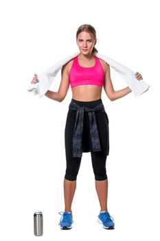 Portrait of sporty young woman tired after a gym workout. Woman with a white towel and a bottle of water isolated on white background