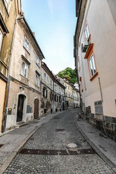 Ljubljana, Slovenia - May 20, 2018: Ljubljana cityscape. Old town of Ljubljana, Slovenia. Buildings facades and narrow street.