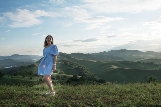 Woman in blue dress in Altai mountain, beauty summer landcape, travel, lesure concept/