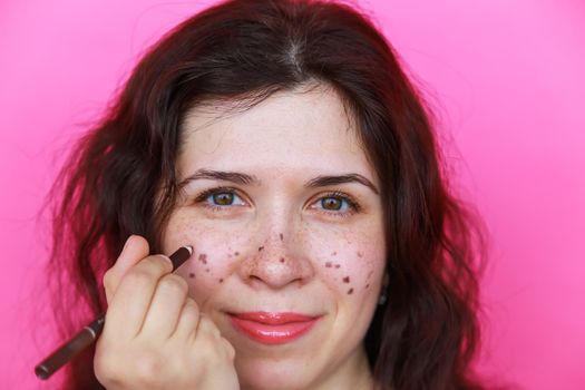 Portrait of bright beautiful girl with art colorful freckles make-up. Body positivity.