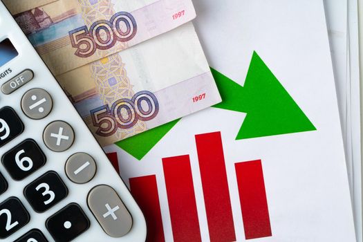 Financial chart with Russian rubles money stack with calculator. Currency appreciation concept. High quality photo