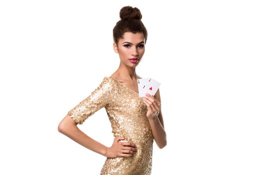 Beautiful young woman holding two ace of cards in her hand isolated on white. Studio shot. Poker