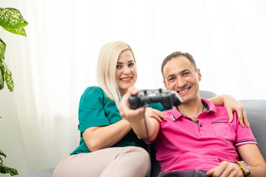 Portrait of happy excited family playing video games