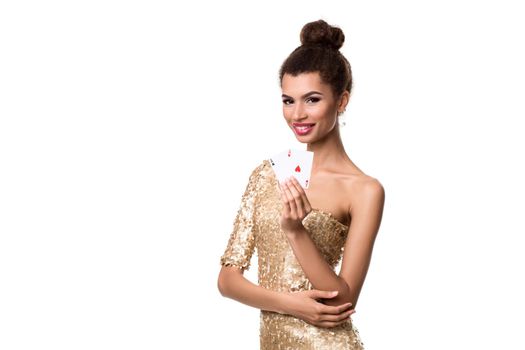 Beautiful young woman holding two ace of cards in her hand isolated on white. Studio shot. Poker