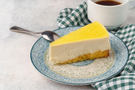 Lemon cheesecake on the plate close up photo