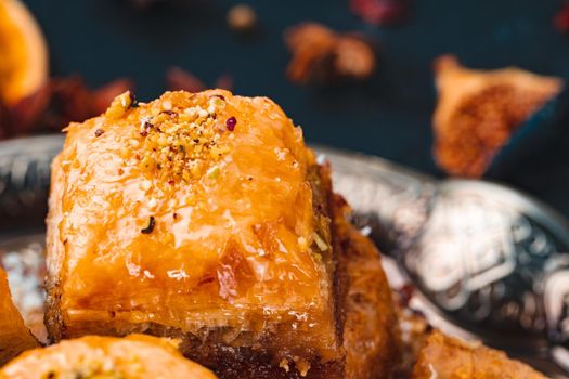 Turkish arabic desserts baklava on silver plate close up
