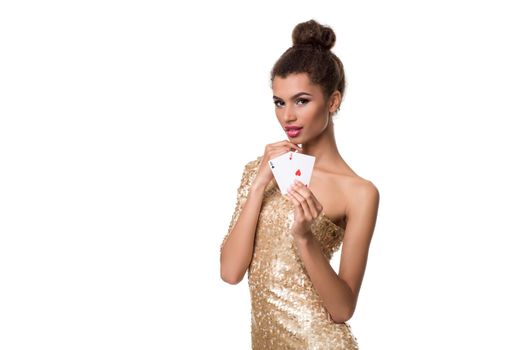 Beautiful young woman holding two ace of cards in her hand isolated on white. Studio shot. Poker