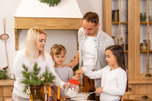 kids baking christmas cookies before the celebration of Christmas. Family