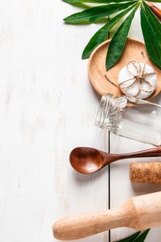 Zero waste concept. Natural biodegradable kitchen utensils on a white wooden background. Place for text.