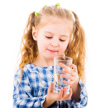 Cute little baby girl holding a glass of pure water isolated on white background