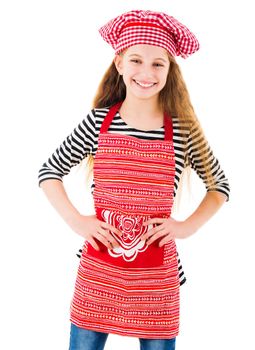 Little girl in red chef uniform smiles isolated on white background