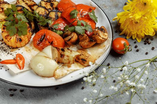 grilled vegetables on a white plate. Grilled fresh vegetables.