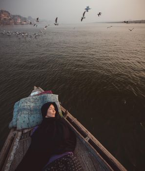 A girl in a boat. High quality photo