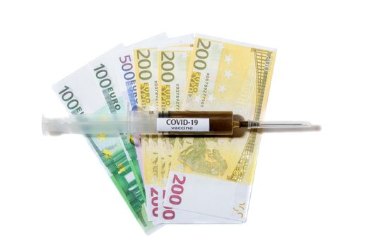 Close up view of needle on a syringe filled with vaccine laying on a euro banknote. Isolated on white background