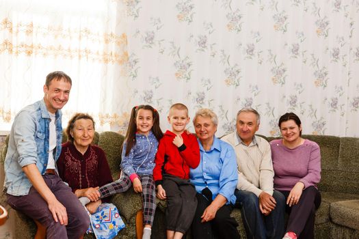 Happy big family on the sofa at home