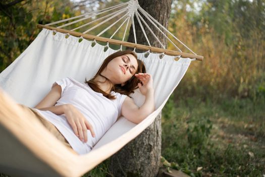 woman sleeping in hammock outdoors leisure lifestyle. High quality photo