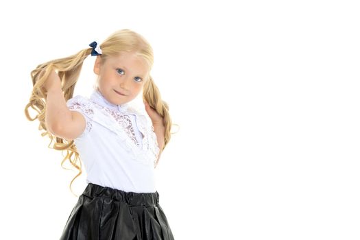 Portrait of a trendy little girl on a white background. The concept of photo for the cover of the magazine, stylish children's clothing. Isolated.