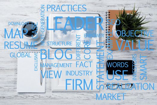 Top view of modern workplace with office stuff and business-related terms above presenting still office life