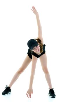 A teenage girl is engaged in fitness. She performs various exercises. The concept of childhood, sport, a healthy lifestyle. Isolated on white background.