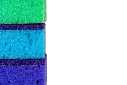 Stack of kitchen sponges isolated on white background, close up