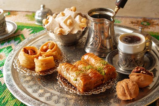 Traditional arabic dessert baklava with a cup of turkish coffee, close up