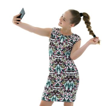 Happy little girl enjoys a smartphone. The concept of people and technology. Isolated on white background.