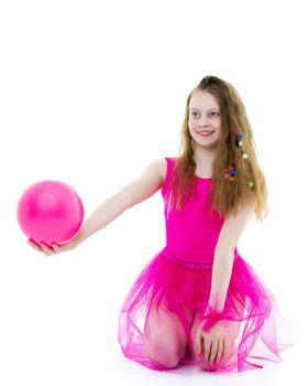 Beautiful little girl gymnast performs exercises with the ball. The concept of children's sports, fitness. Isolated on white background.