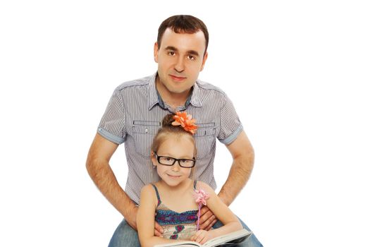 Father and daughter sitting on the floor and read a book-Isolated on white background