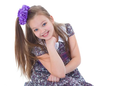 Beautiful little girl posing in the studio. Children's emotions concept. Close-up. Isolated on white background.